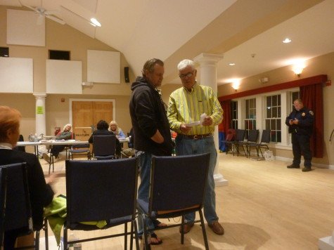 Trustee-elect Christopher Norris consulting with Ocean Beach resident John Moran before the final vote was determined.
