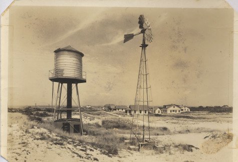2.The original Kismet water tower with houses in the background, year unknown.