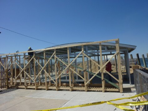 Neither scaffolding nor police tape was enough to stop this plucky citizen from being among the first to enjoy the new ferry terminal shelter.