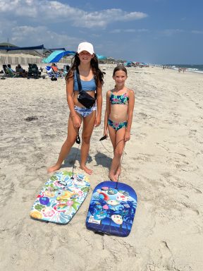 Girls selling shells on Fire Island beach.