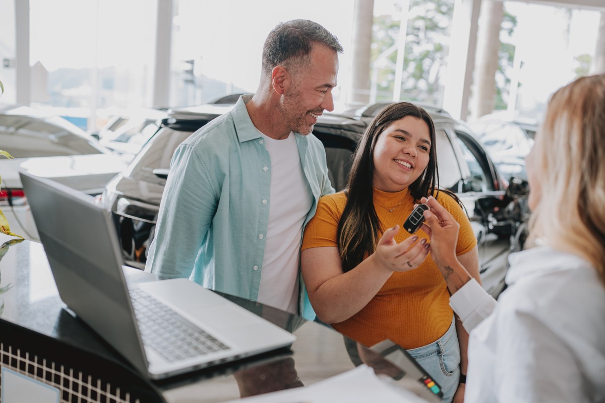 Daughter receiving car keys