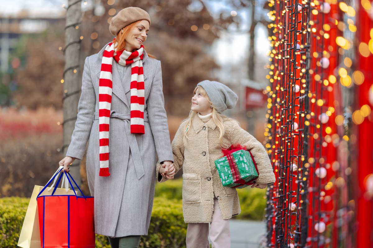 Mother and daughter enjoying festive holiday shopping together