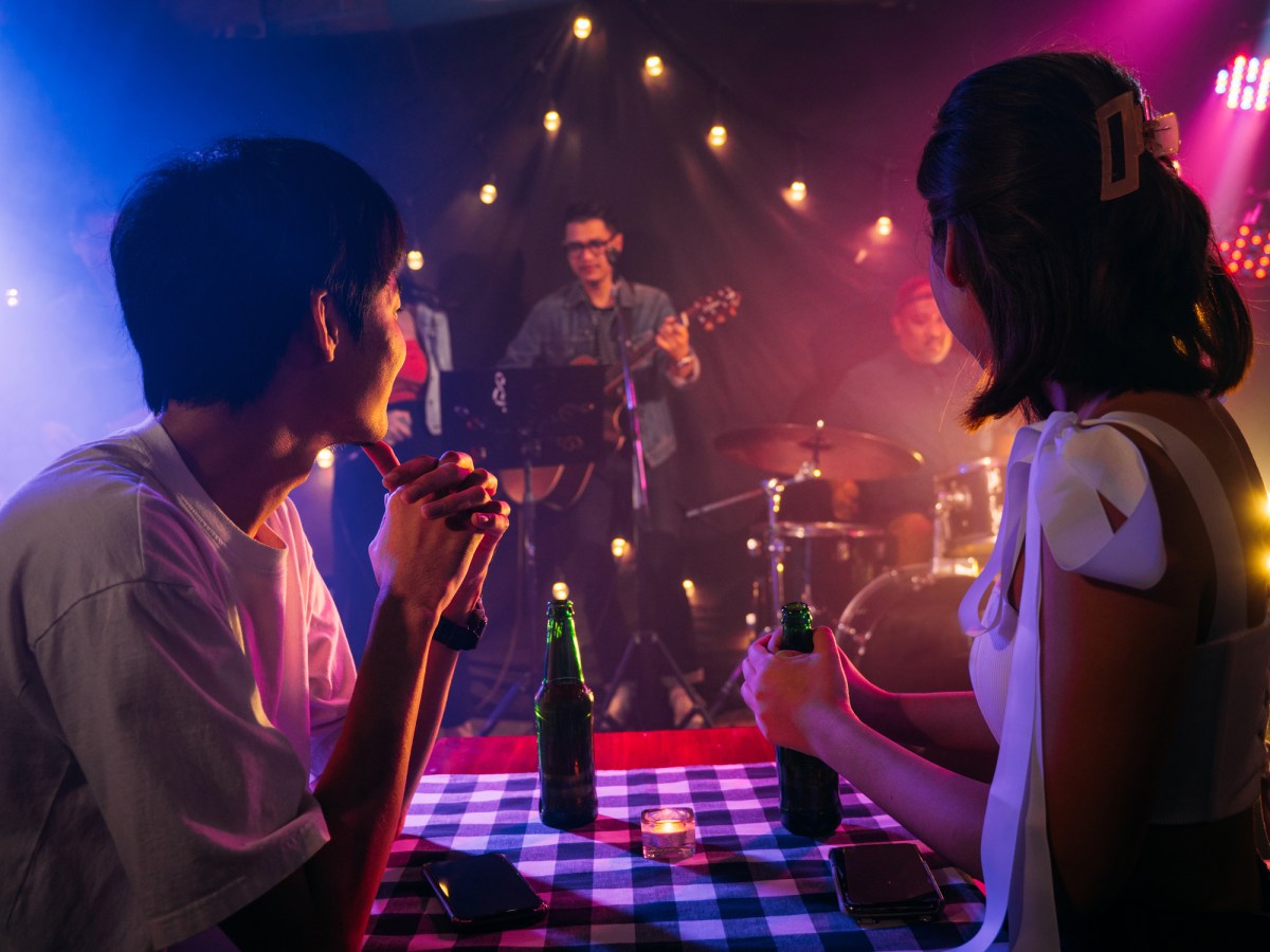 Asian couple celebrating at party.